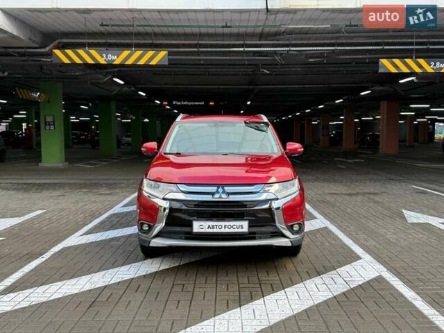 Красный Мицубиси Аутлендер, объемом двигателя 3 л и пробегом 167 тыс. км за 16990 $, фото 2 на Automoto.ua