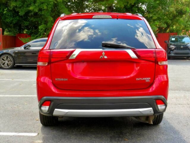 Червоний Міцубісі Аутлендер, об'ємом двигуна 2.4 л та пробігом 71 тис. км за 10800 $, фото 4 на Automoto.ua