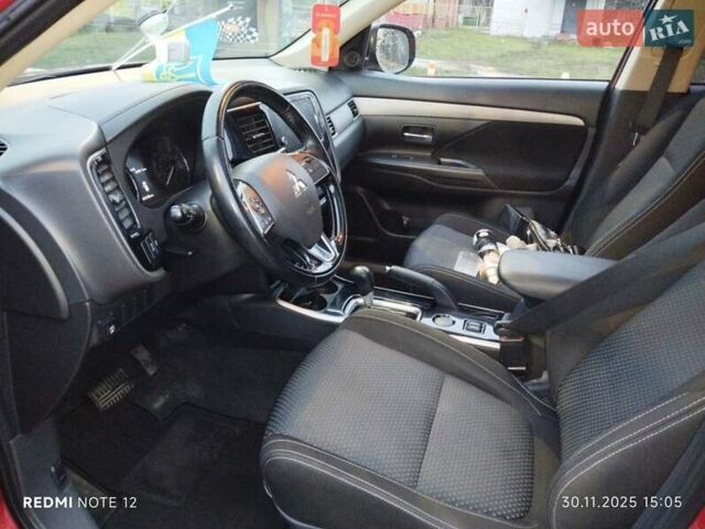 Красный Мицубиси Аутлендер, объемом двигателя 2.36 л и пробегом 118 тыс. км за 14000 $, фото 4 на Automoto.ua