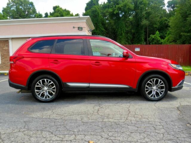 Червоний Міцубісі Аутлендер, об'ємом двигуна 2.4 л та пробігом 71 тис. км за 10800 $, фото 2 на Automoto.ua