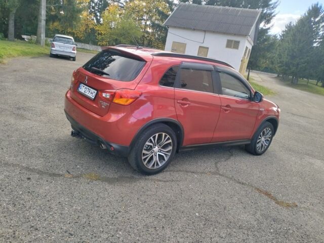 Красный Мицубиси Аутлендер, объемом двигателя 2.4 л и пробегом 185 тыс. км за 12200 $, фото 7 на Automoto.ua