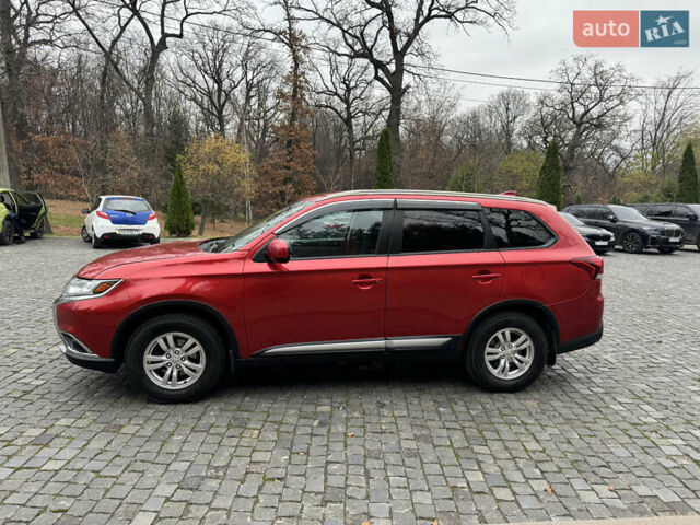 Красный Мицубиси Аутлендер, объемом двигателя 2.4 л и пробегом 225 тыс. км за 11900 $, фото 3 на Automoto.ua