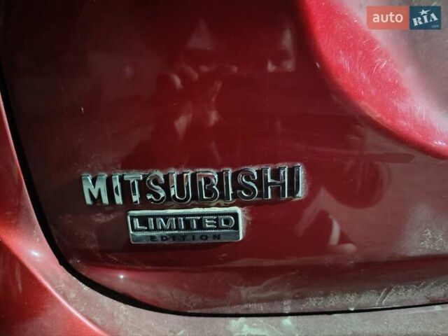 Красный Мицубиси Аутлендер, объемом двигателя 2.36 л и пробегом 60 тыс. км за 15500 $, фото 2 на Automoto.ua