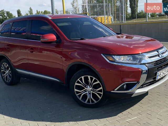 Красный Мицубиси Аутлендер, объемом двигателя 2.4 л и пробегом 113 тыс. км за 15900 $, фото 1 на Automoto.ua