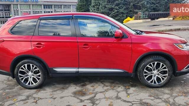 Красный Мицубиси Аутлендер, объемом двигателя 2.36 л и пробегом 80 тыс. км за 16500 $, фото 2 на Automoto.ua
