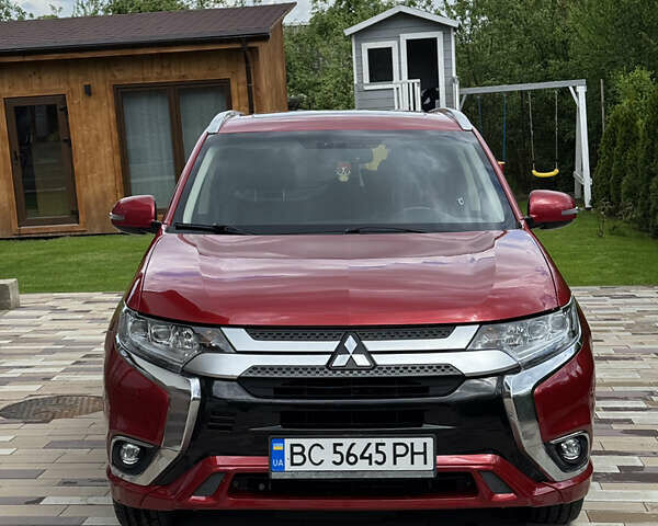Красный Мицубиси Аутлендер, объемом двигателя 2 л и пробегом 127 тыс. км за 21500 $, фото 2 на Automoto.ua