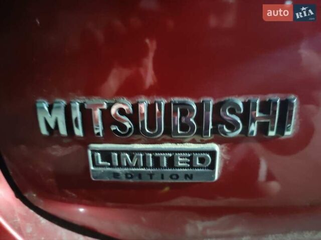Красный Мицубиси Аутлендер, объемом двигателя 2.36 л и пробегом 60 тыс. км за 15500 $, фото 3 на Automoto.ua