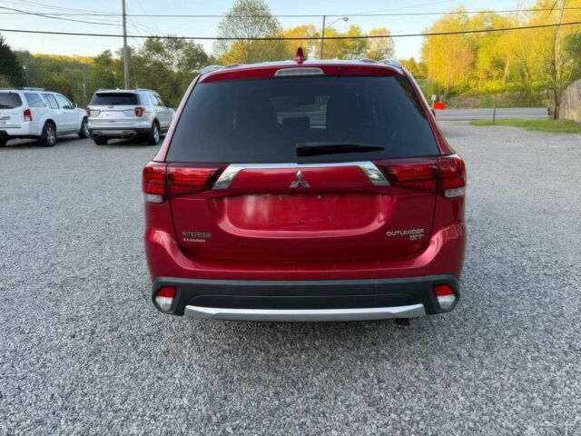 Красный Мицубиси Аутлендер, объемом двигателя 3 л и пробегом 57 тыс. км за 13200 $, фото 5 на Automoto.ua