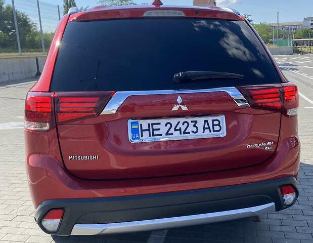 Красный Мицубиси Аутлендер, объемом двигателя 2.4 л и пробегом 113 тыс. км за 15900 $, фото 3 на Automoto.ua