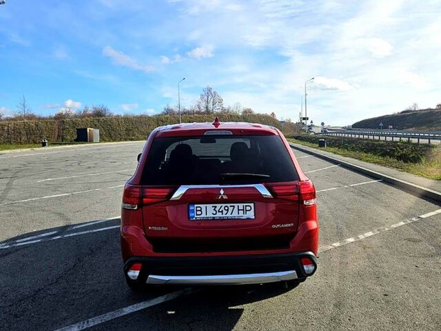 Красный Мицубиси Аутлендер, объемом двигателя 2.4 л и пробегом 174 тыс. км за 14300 $, фото 1 на Automoto.ua