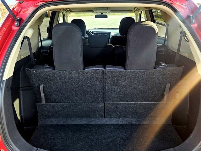 Красный Мицубиси Аутлендер, объемом двигателя 2.4 л и пробегом 174 тыс. км за 14300 $, фото 7 на Automoto.ua