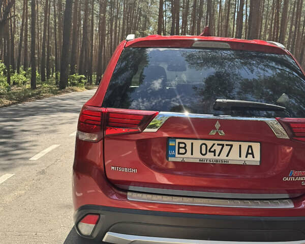 Красный Мицубиси Аутлендер, объемом двигателя 2.36 л и пробегом 133 тыс. км за 16300 $, фото 6 на Automoto.ua