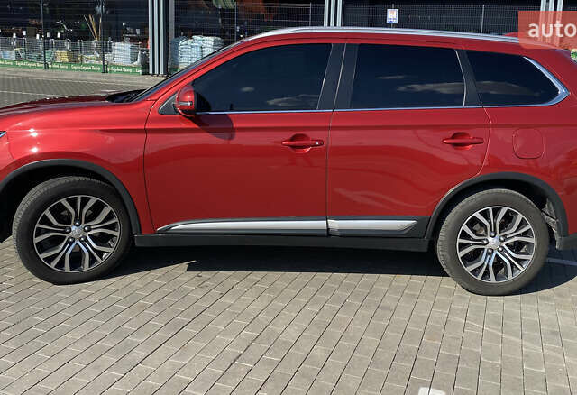 Красный Мицубиси Аутлендер, объемом двигателя 2.4 л и пробегом 113 тыс. км за 15900 $, фото 4 на Automoto.ua