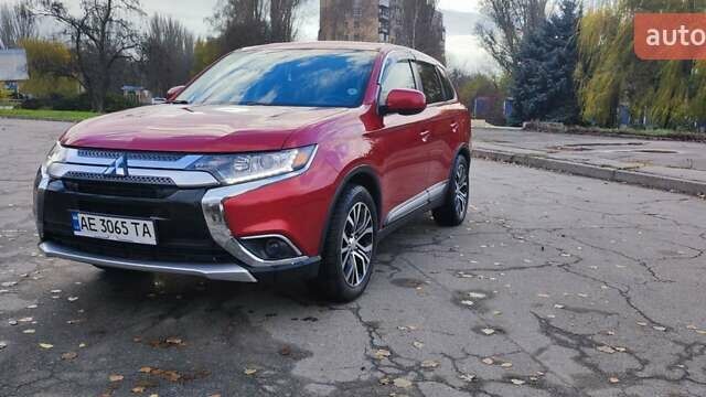Красный Мицубиси Аутлендер, объемом двигателя 2.36 л и пробегом 80 тыс. км за 16500 $, фото 1 на Automoto.ua