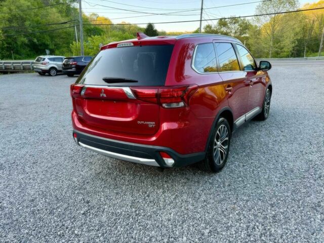 Красный Мицубиси Аутлендер, объемом двигателя 3 л и пробегом 57 тыс. км за 13200 $, фото 6 на Automoto.ua