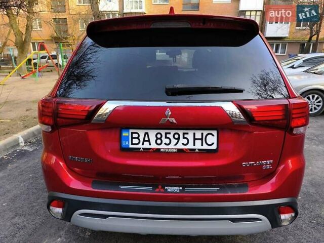 Красный Мицубиси Аутлендер, объемом двигателя 2.4 л и пробегом 125 тыс. км за 17400 $, фото 3 на Automoto.ua