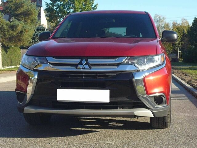 Красный Мицубиси Аутлендер, объемом двигателя 2.4 л и пробегом 117 тыс. км за 10500 $, фото 1 на Automoto.ua