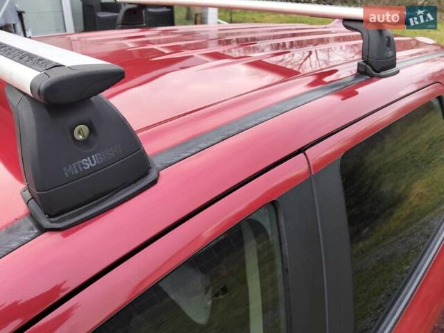 Красный Мицубиси Аутлендер, объемом двигателя 2.36 л и пробегом 110 тыс. км за 16800 $, фото 5 на Automoto.ua