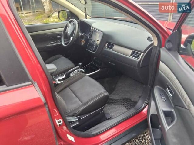 Красный Мицубиси Аутлендер, объемом двигателя 2.36 л и пробегом 110 тыс. км за 16800 $, фото 12 на Automoto.ua