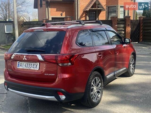 Красный Мицубиси Аутлендер, объемом двигателя 2.4 л и пробегом 75 тыс. км за 16550 $, фото 4 на Automoto.ua