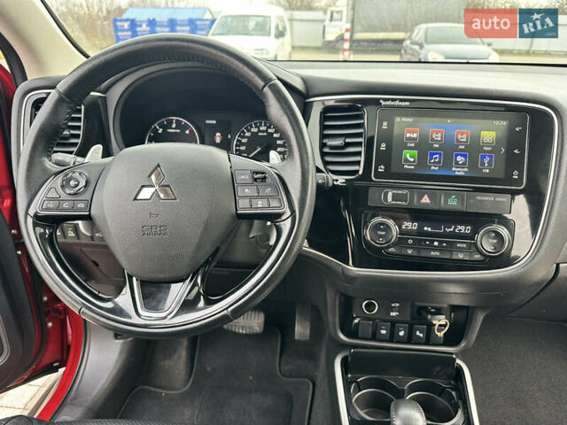Красный Мицубиси Аутлендер, объемом двигателя 2.2 л и пробегом 118 тыс. км за 20999 $, фото 63 на Automoto.ua