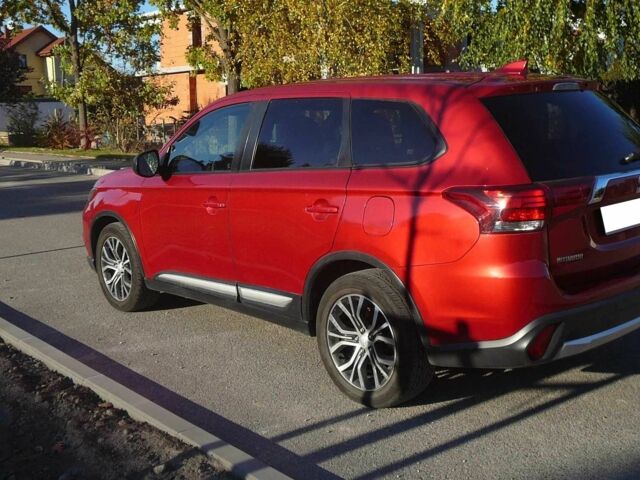 Красный Мицубиси Аутлендер, объемом двигателя 2.4 л и пробегом 117 тыс. км за 10500 $, фото 3 на Automoto.ua