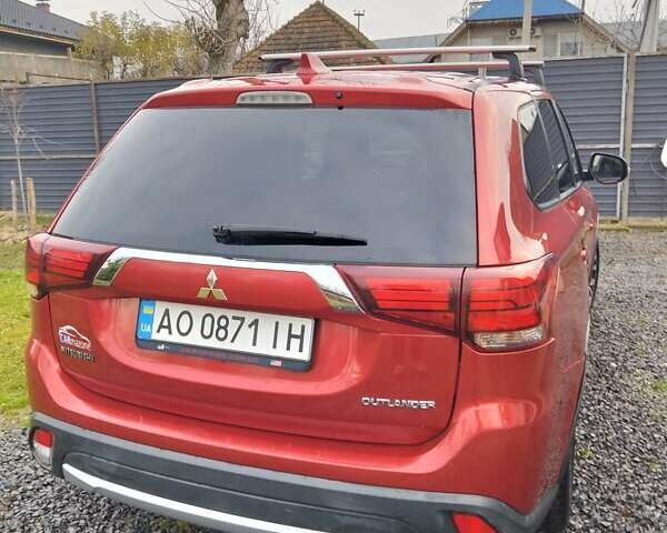 Красный Мицубиси Аутлендер, объемом двигателя 2.36 л и пробегом 110 тыс. км за 16800 $, фото 6 на Automoto.ua