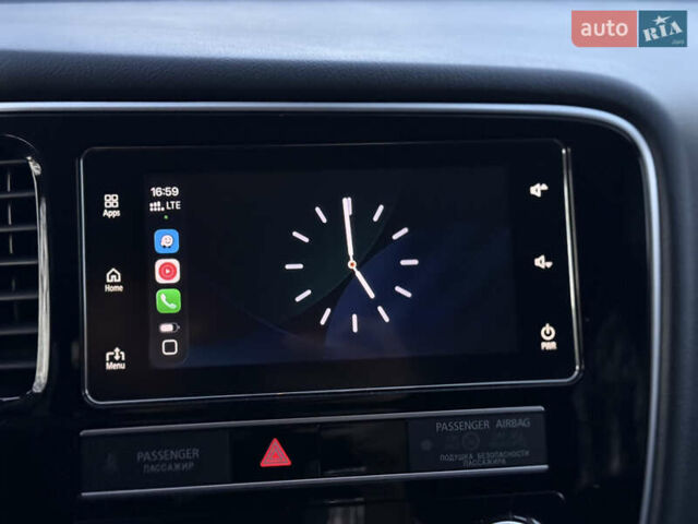 Красный Мицубиси Аутлендер, объемом двигателя 2 л и пробегом 85 тыс. км за 18900 $, фото 79 на Automoto.ua