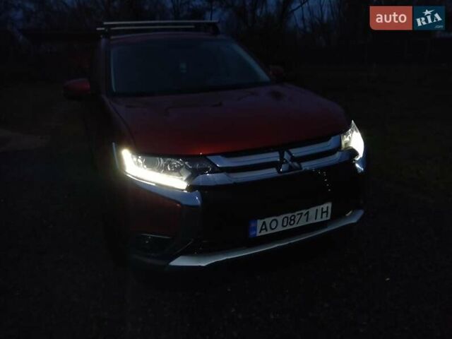 Красный Мицубиси Аутлендер, объемом двигателя 2.36 л и пробегом 110 тыс. км за 16800 $, фото 2 на Automoto.ua