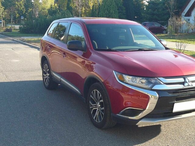 Красный Мицубиси Аутлендер, объемом двигателя 2.4 л и пробегом 117 тыс. км за 10500 $, фото 4 на Automoto.ua