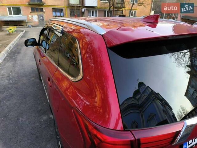 Красный Мицубиси Аутлендер, объемом двигателя 2.4 л и пробегом 125 тыс. км за 17400 $, фото 2 на Automoto.ua