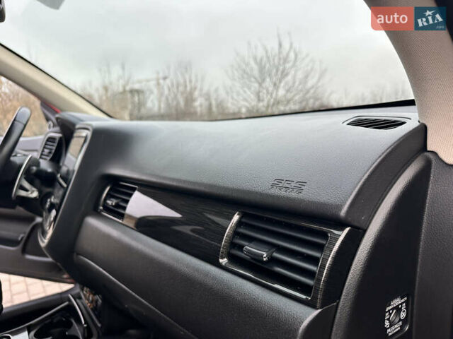 Красный Мицубиси Аутлендер, объемом двигателя 2.2 л и пробегом 118 тыс. км за 20999 $, фото 56 на Automoto.ua