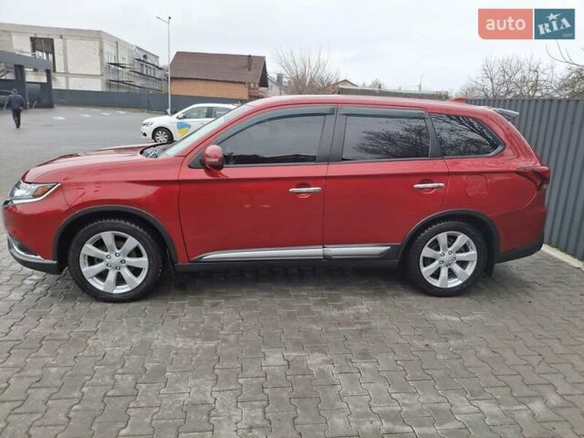 Красный Мицубиси Аутлендер, объемом двигателя 2.36 л и пробегом 110 тыс. км за 19000 $, фото 2 на Automoto.ua