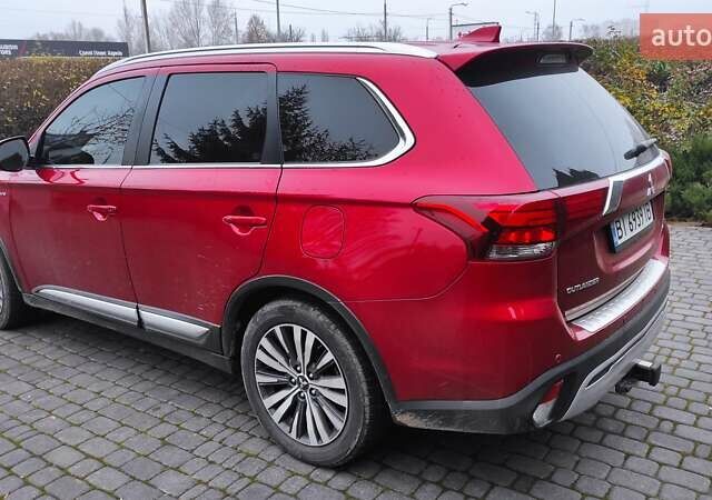 Червоний Міцубісі Аутлендер, об'ємом двигуна 3 л та пробігом 127 тис. км за 28500 $, фото 3 на Automoto.ua