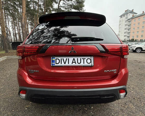 Красный Мицубиси Аутлендер, объемом двигателя 2.4 л и пробегом 197 тыс. км за 18700 $, фото 3 на Automoto.ua