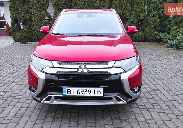 Червоний Міцубісі Аутлендер, об'ємом двигуна 3 л та пробігом 127 тис. км за 28500 $, фото 6 на Automoto.ua