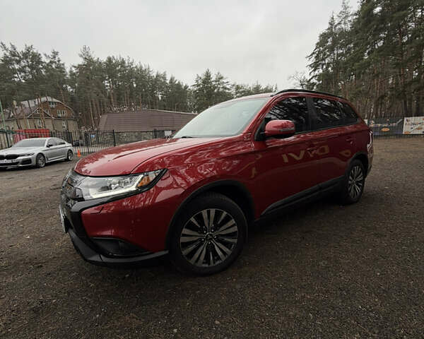 Красный Мицубиси Аутлендер, объемом двигателя 2.4 л и пробегом 197 тыс. км за 18700 $, фото 5 на Automoto.ua