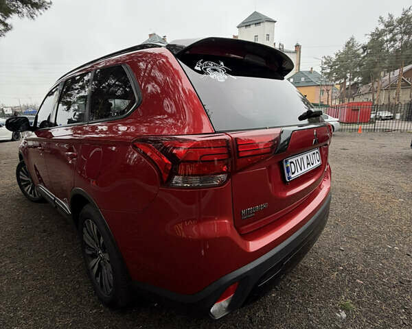 Красный Мицубиси Аутлендер, объемом двигателя 2.4 л и пробегом 197 тыс. км за 18700 $, фото 4 на Automoto.ua
