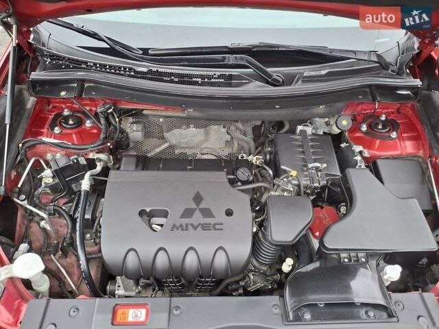 Красный Мицубиси Аутлендер, объемом двигателя 2.36 л и пробегом 110 тыс. км за 19000 $, фото 5 на Automoto.ua