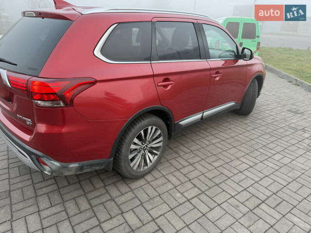 Красный Мицубиси Аутлендер, объемом двигателя 3 л и пробегом 106 тыс. км за 20700 $, фото 4 на Automoto.ua