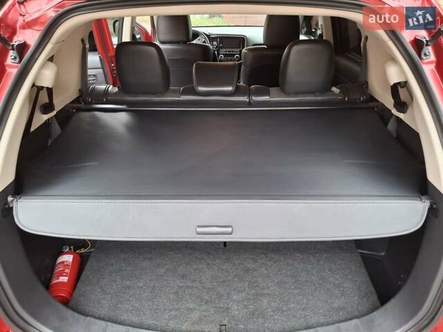 Красный Мицубиси Аутлендер, объемом двигателя 2.36 л и пробегом 110 тыс. км за 19000 $, фото 29 на Automoto.ua