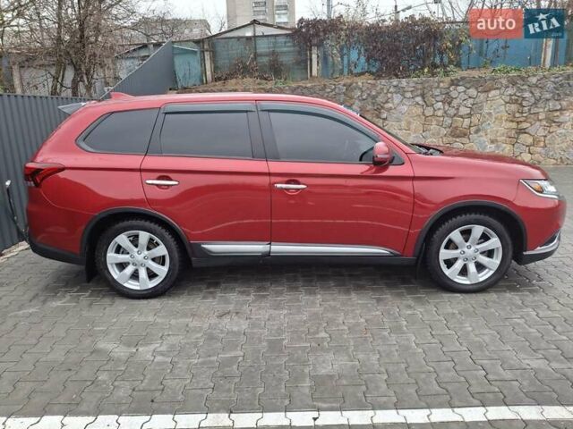 Красный Мицубиси Аутлендер, объемом двигателя 2.36 л и пробегом 110 тыс. км за 19000 $, фото 3 на Automoto.ua