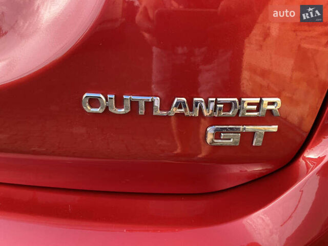 Красный Мицубиси Аутлендер, объемом двигателя 3 л и пробегом 106 тыс. км за 20700 $, фото 28 на Automoto.ua