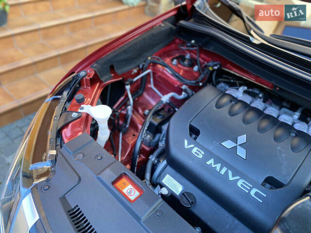 Красный Мицубиси Аутлендер, объемом двигателя 3 л и пробегом 106 тыс. км за 20700 $, фото 23 на Automoto.ua