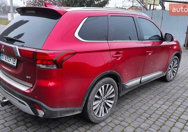 Червоний Міцубісі Аутлендер, об'ємом двигуна 3 л та пробігом 127 тис. км за 28500 $, фото 2 на Automoto.ua