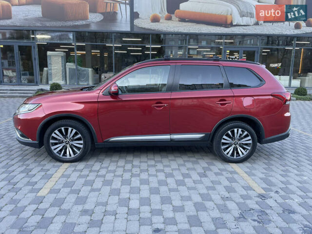 Красный Мицубиси Аутлендер, объемом двигателя 2.36 л и пробегом 100 тыс. км за 16500 $, фото 3 на Automoto.ua