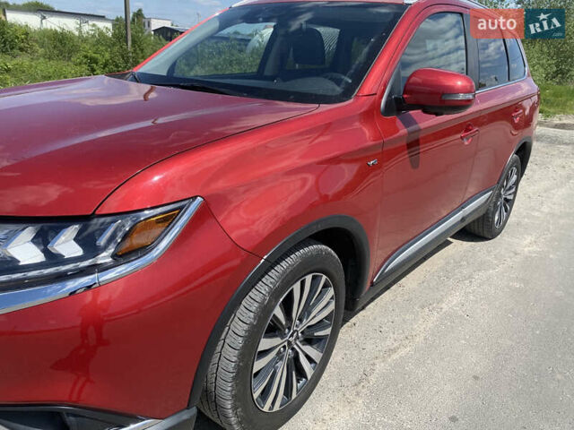 Красный Мицубиси Аутлендер, объемом двигателя 3 л и пробегом 106 тыс. км за 20700 $, фото 5 на Automoto.ua