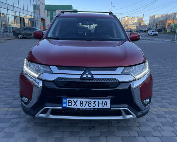 Красный Мицубиси Аутлендер, объемом двигателя 2.36 л и пробегом 100 тыс. км за 16500 $, фото 1 на Automoto.ua