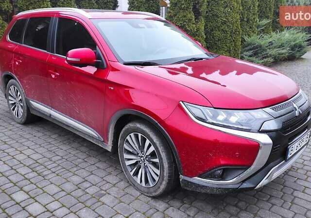 Червоний Міцубісі Аутлендер, об'ємом двигуна 3 л та пробігом 127 тис. км за 28500 $, фото 1 на Automoto.ua