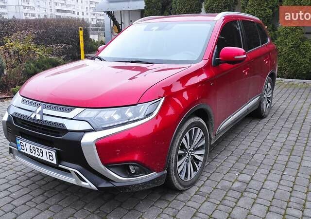 Червоний Міцубісі Аутлендер, об'ємом двигуна 3 л та пробігом 127 тис. км за 28500 $, фото 5 на Automoto.ua